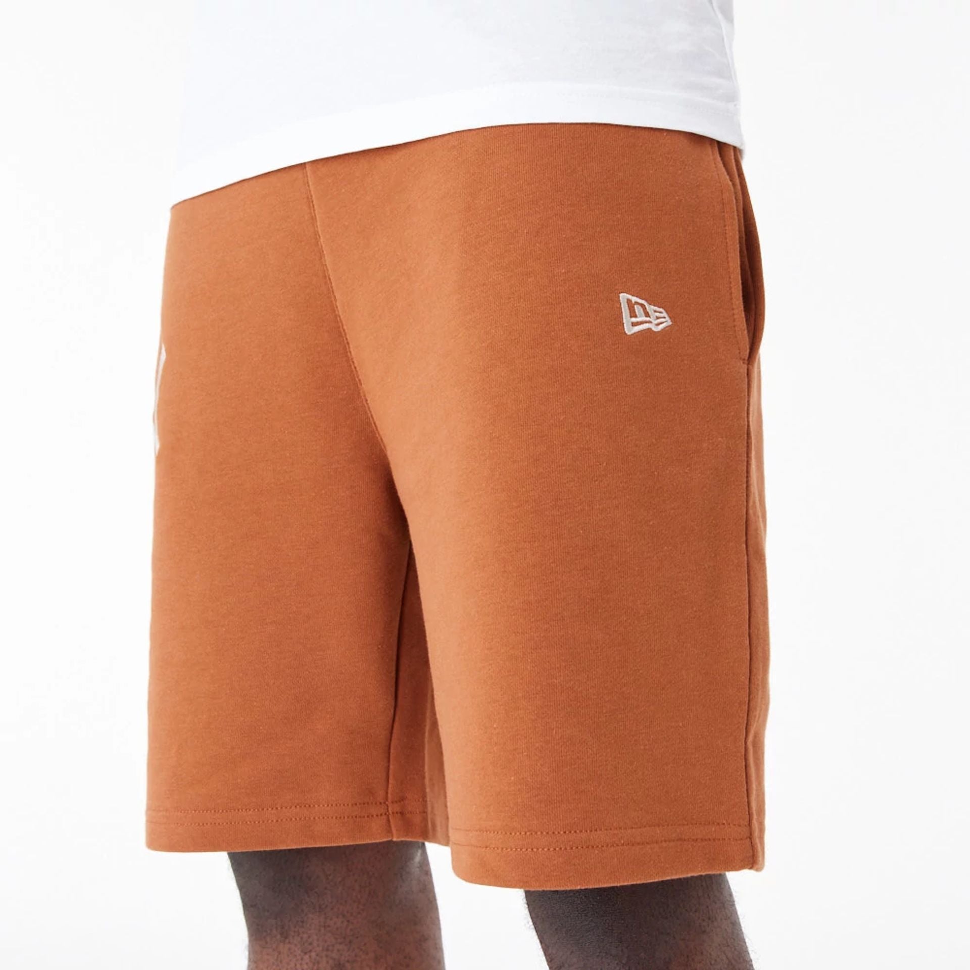 The Male model is wearing New York Yankees League Essential Brown Shorts 3