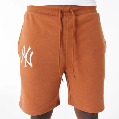 The Male model is wearing New York Yankees League Essential Brown Shorts 6