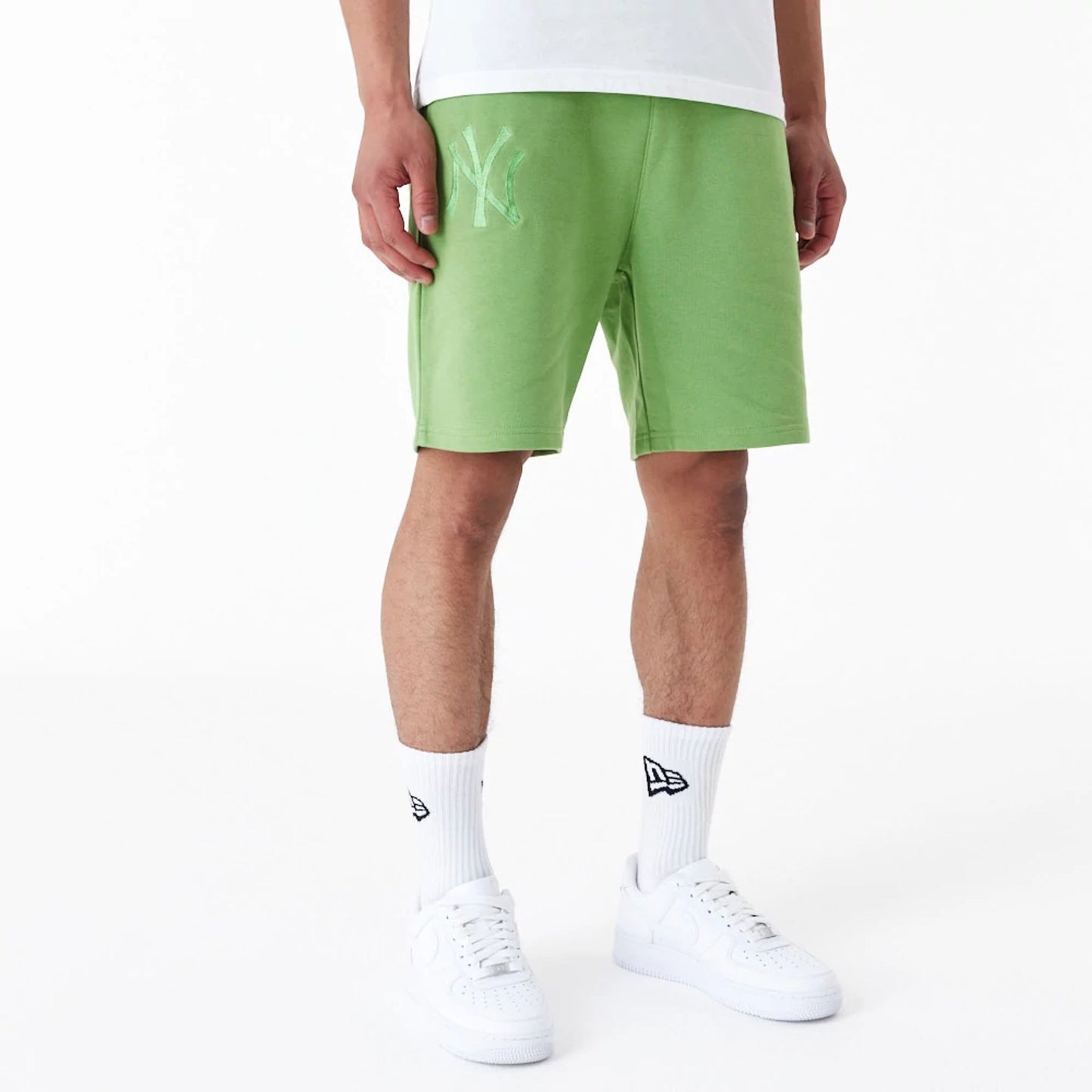 The Male model is wearing New York Yankees League Essential Green Shorts 7