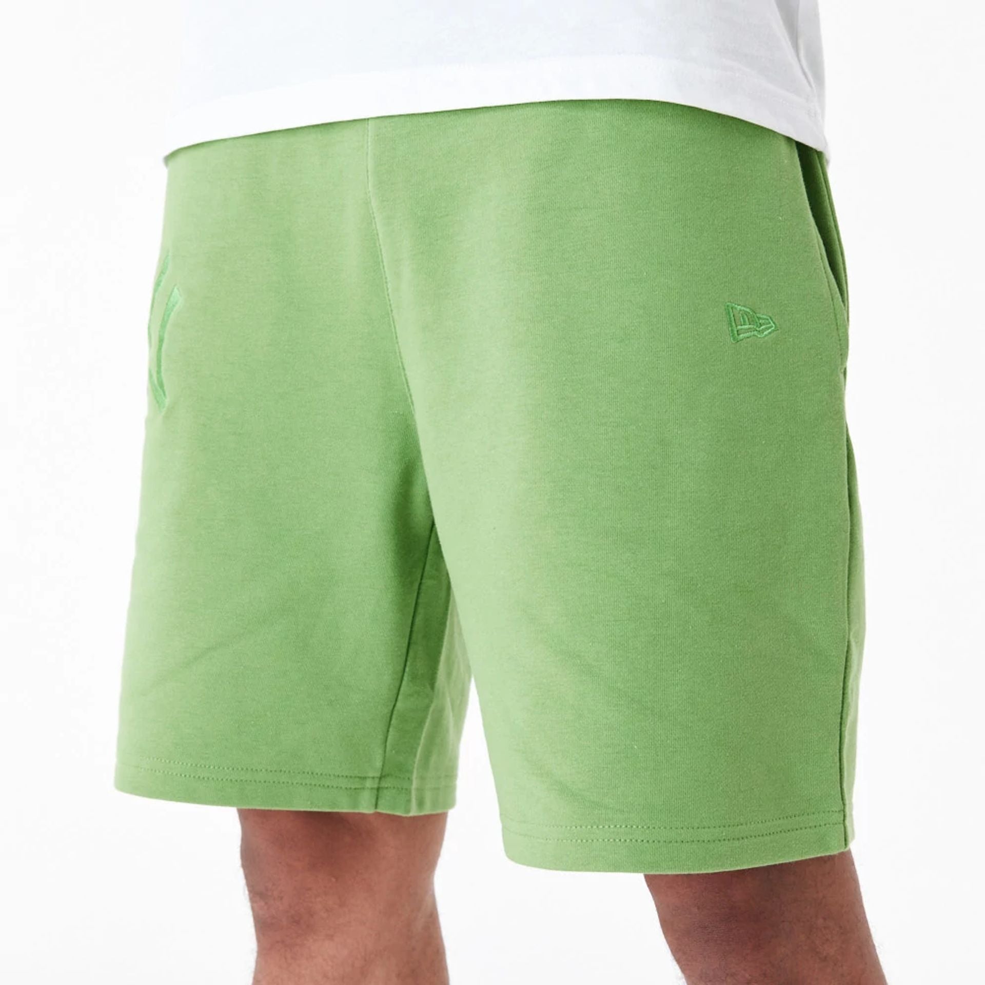 The Male model is wearing New York Yankees League Essential Green Shorts 5