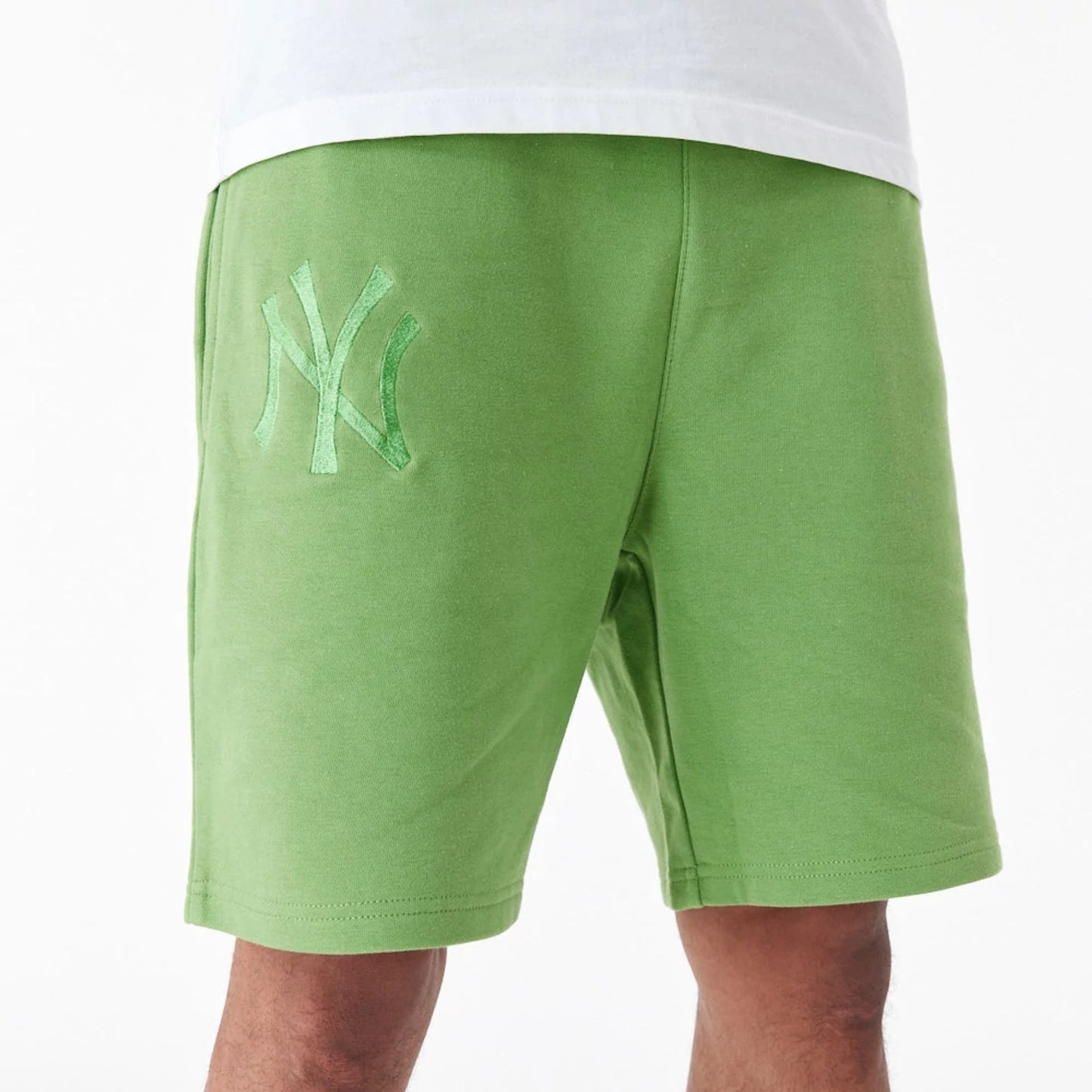 The Male model is wearing New York Yankees League Essential Green Shorts 6