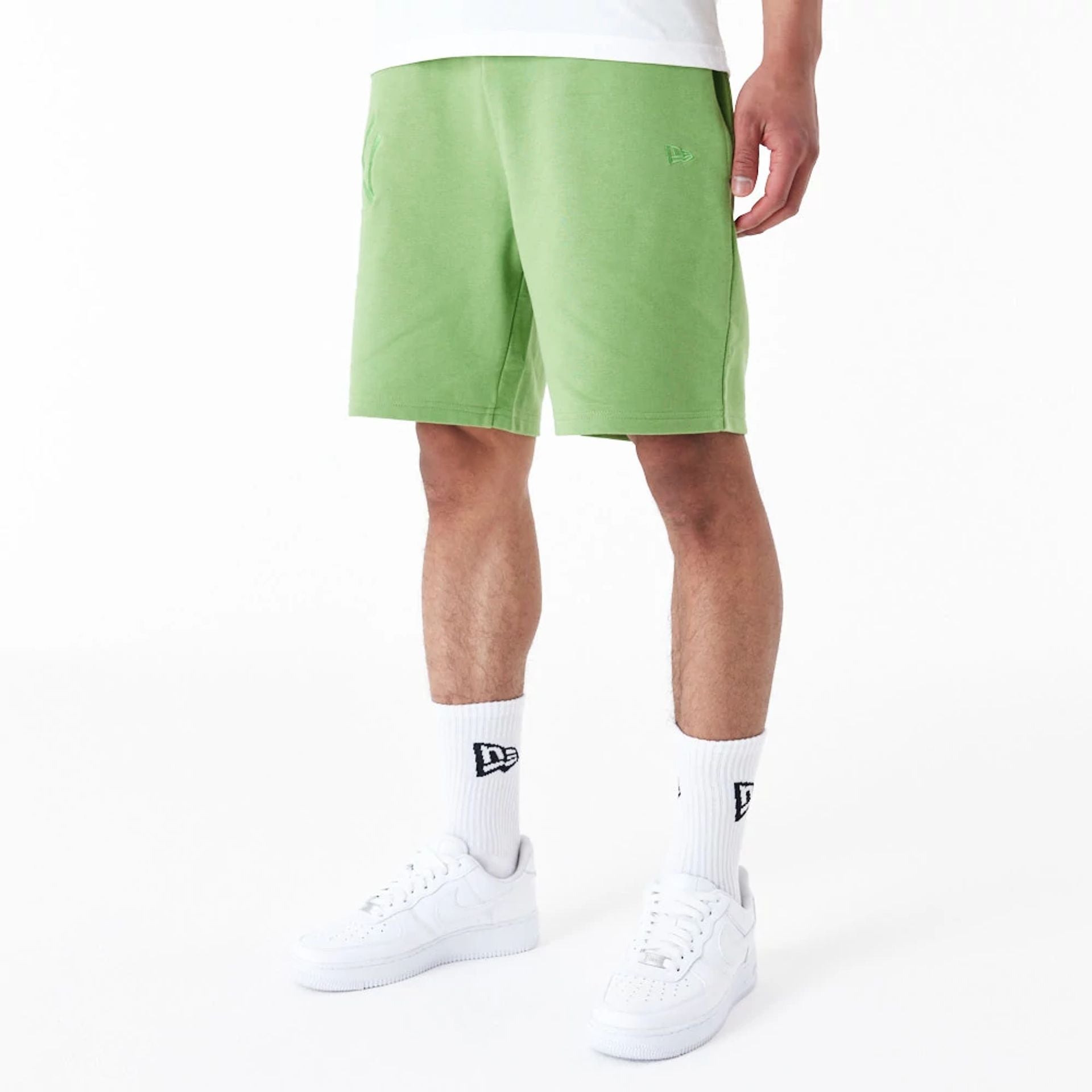 The Male model is wearing New York Yankees League Essential Green Shorts 2