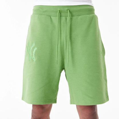 The Male model is wearing New York Yankees League Essential Green Shorts 4