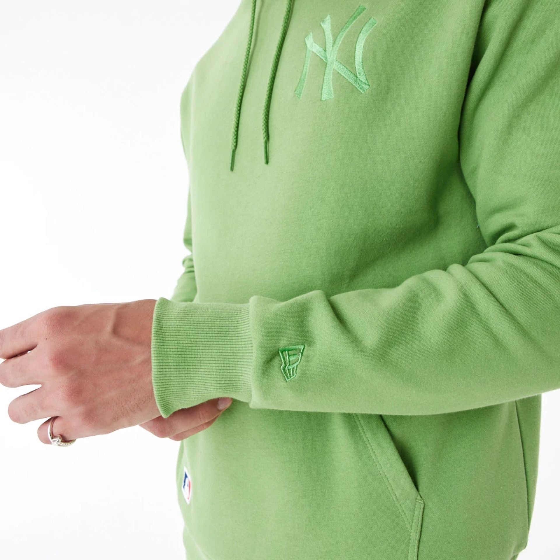 The Male model is wearing New York Yankees League Essential Green Oversized Pullover Hoodie 3