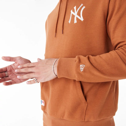 The Male model is wearing New York Yankees League Essential Brown Oversized Pullover Hoodie 10