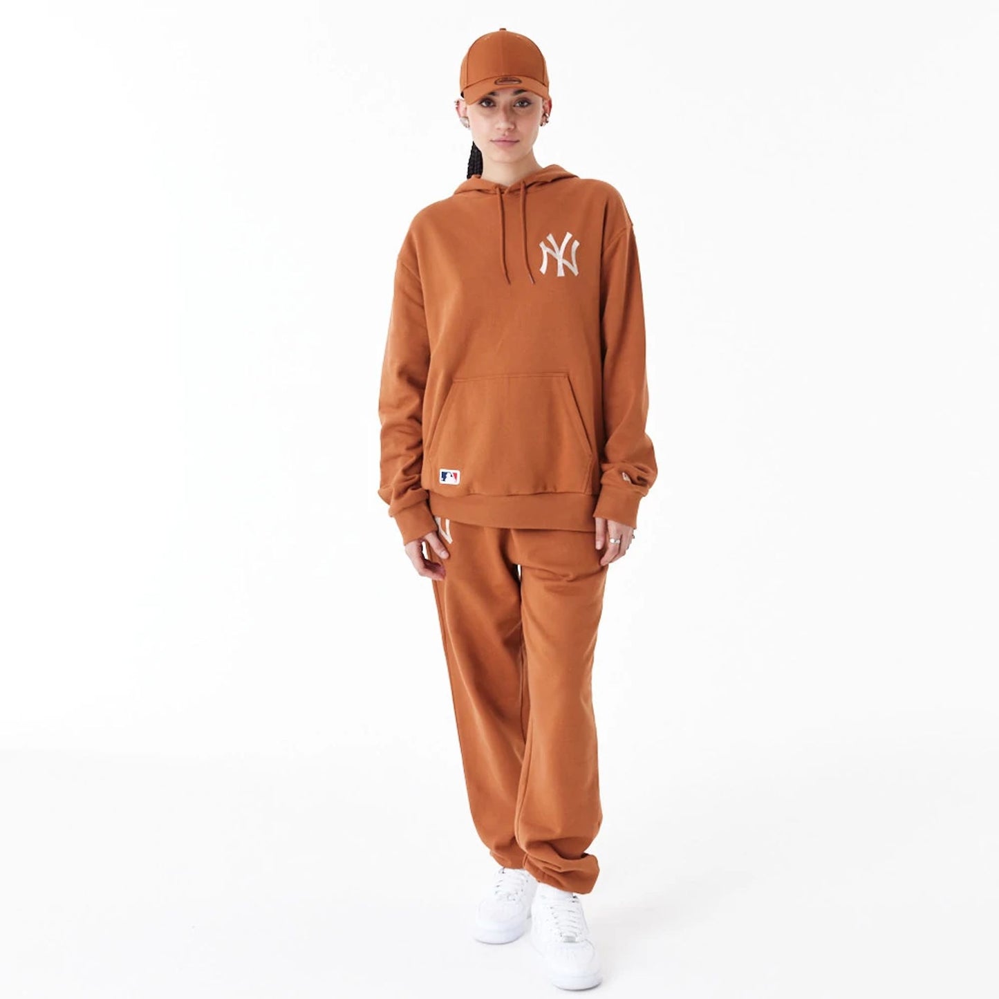 The Male model is wearing New York Yankees League Essential Brown Oversized Pullover Hoodie 4