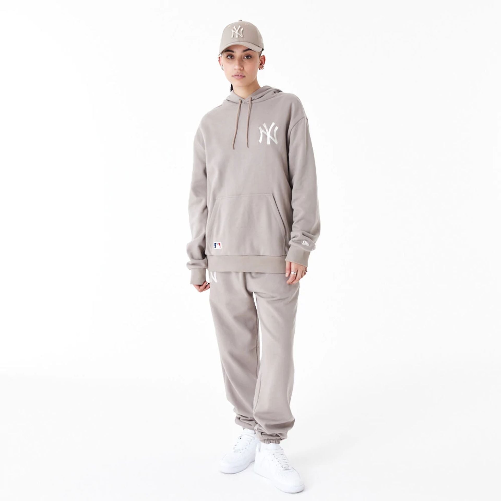 The Male model is wearing New York Yankees League Essential Beige Oversized Pullover Hoodie 11