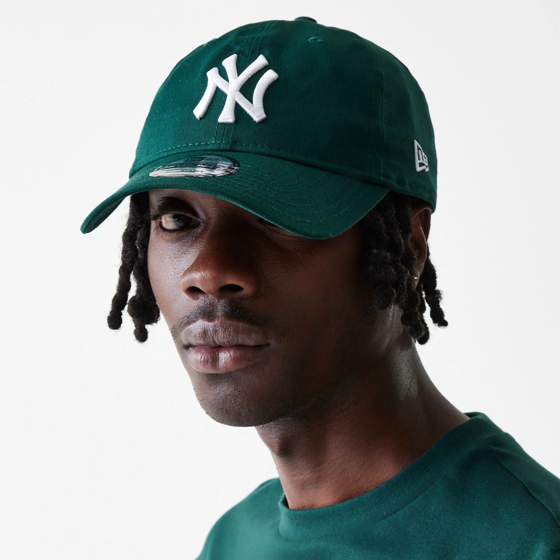 This is a New York Yankees League Essential Dark Green 9TWENTY Adjustable Cap 1