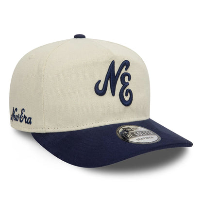 This is a New Era Two Tone Light Beige and Navy Golfer Cap 3