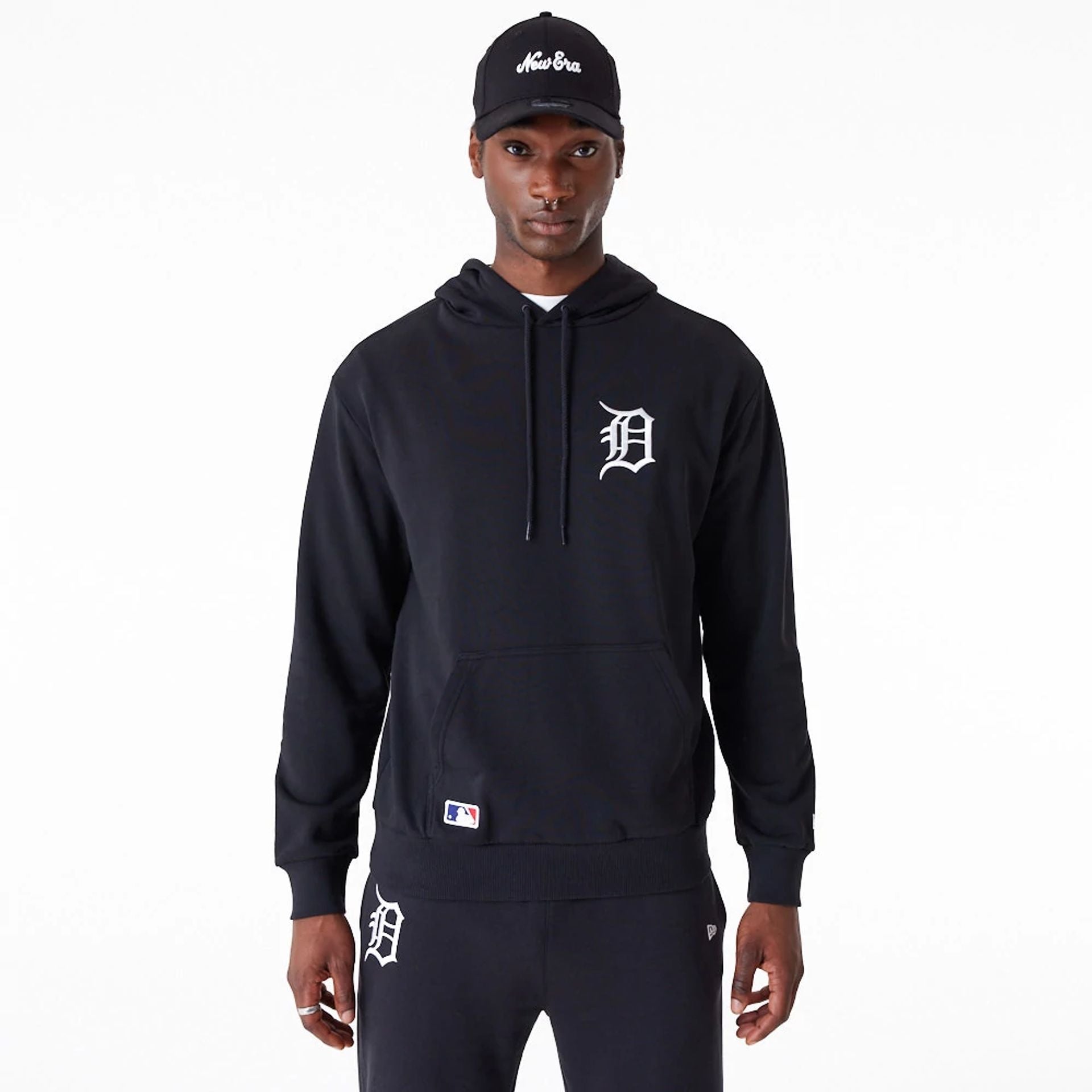 The Male model is wearing Detroit Tigers League Essential Black Oversized Pullover Hoodie 1