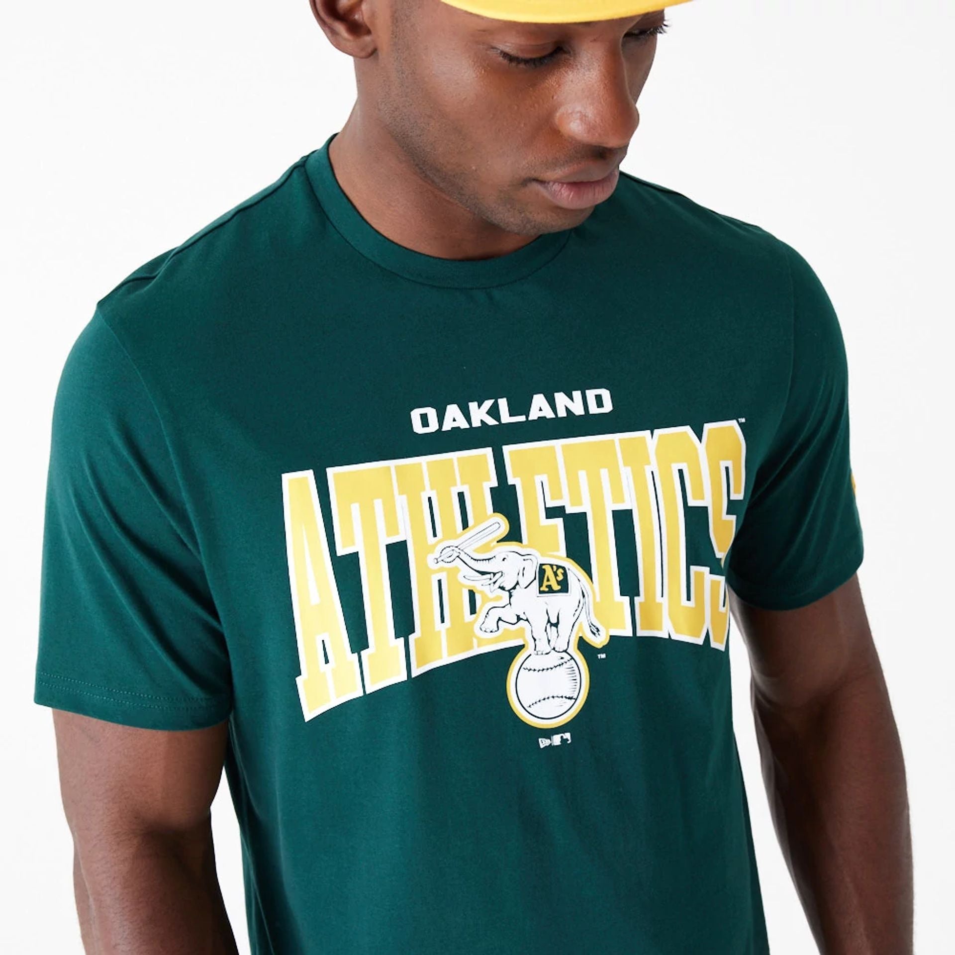 The Male model is wearing Oakland Athletics MLB Arch Wordmark Graphic Dark Green T-Shirt 2