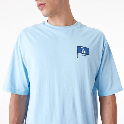 The Male model is wearing LA Dodgers MLB Burger Graphic Pastel Blue Oversized T-Shirt 5