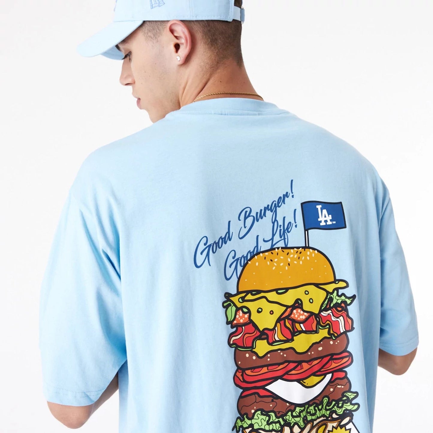 The Male model is wearing LA Dodgers MLB Burger Graphic Pastel Blue Oversized T-Shirt 8