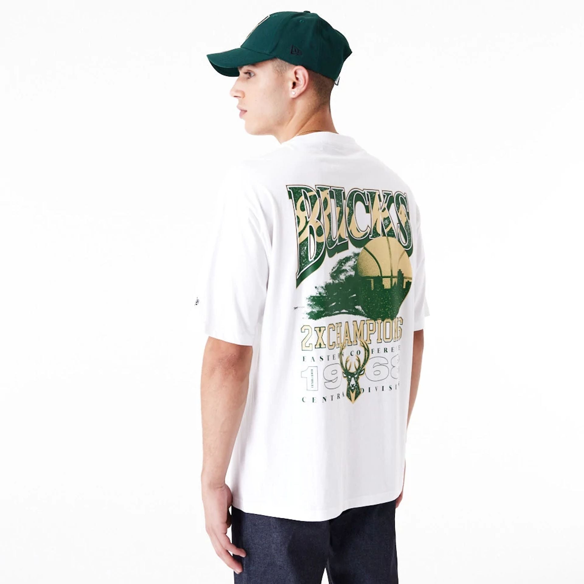 The Male model is wearing Milwaukee Bucks NBA Championship White Oversized T-Shirt 5