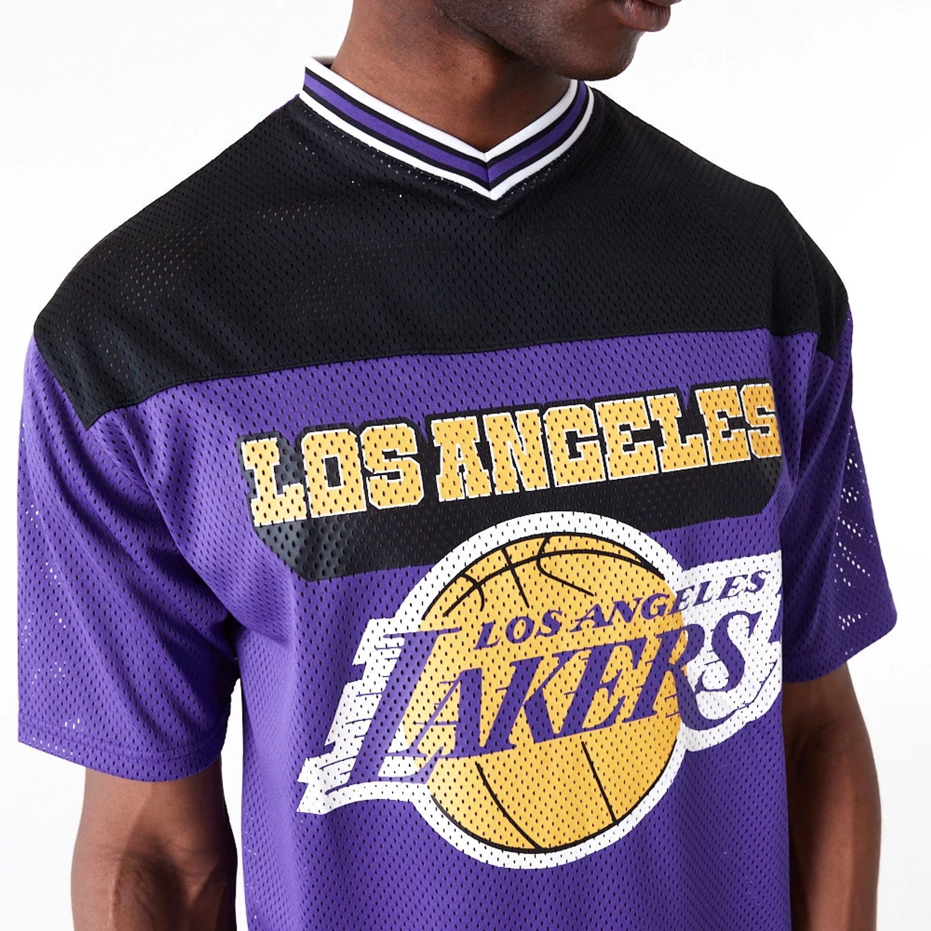 The Male model is wearing LA Lakers NBA Arch Graphic Jersey Purple T-Shirt 7