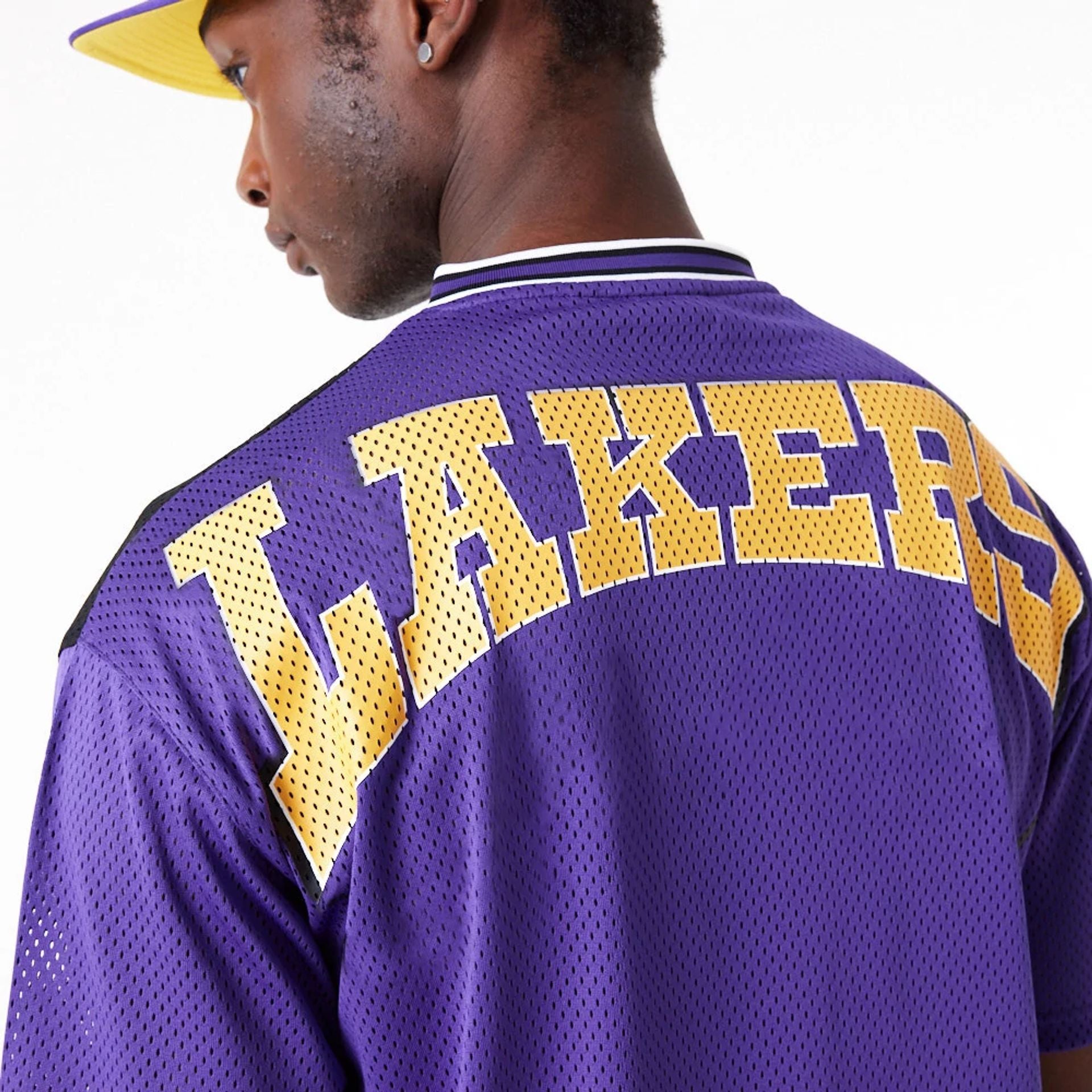 The Male model is wearing LA Lakers NBA Arch Graphic Jersey Purple T-Shirt 8