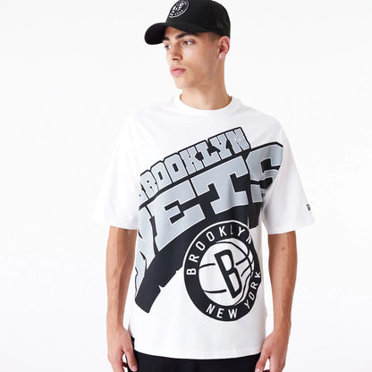 The Male model is wearing Brooklyn Nets NBA Large Wordmark White Oversized T-Shirt 6