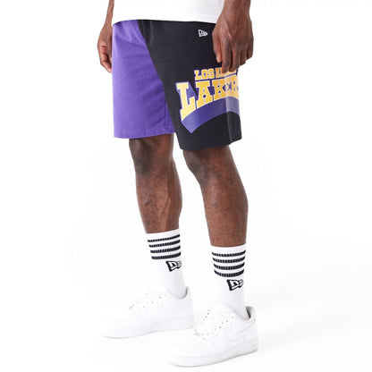 The Male model is wearing LA Lakers NBA Graphic Purple Shorts 3