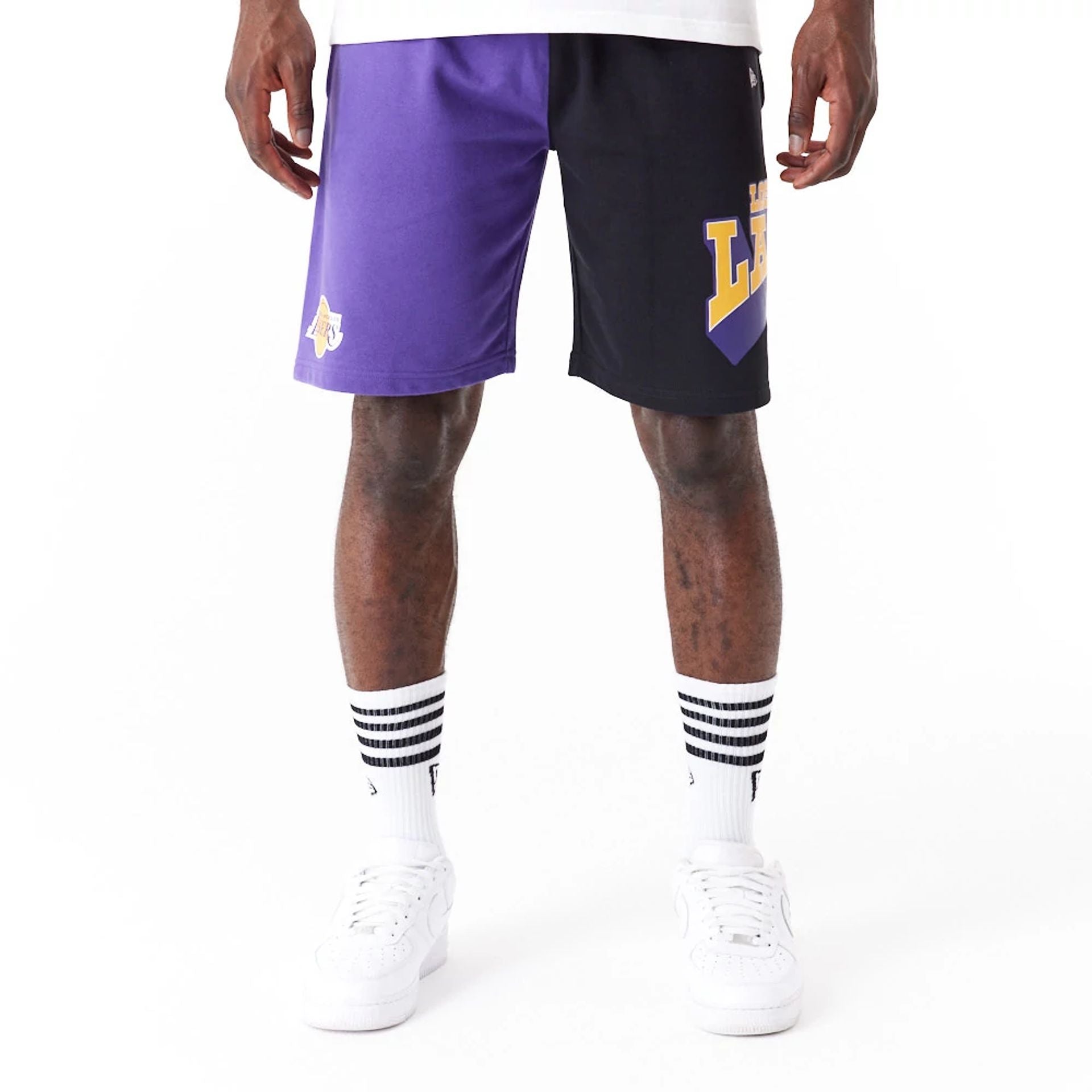 The Male model is wearing LA Lakers NBA Graphic Purple Shorts 1