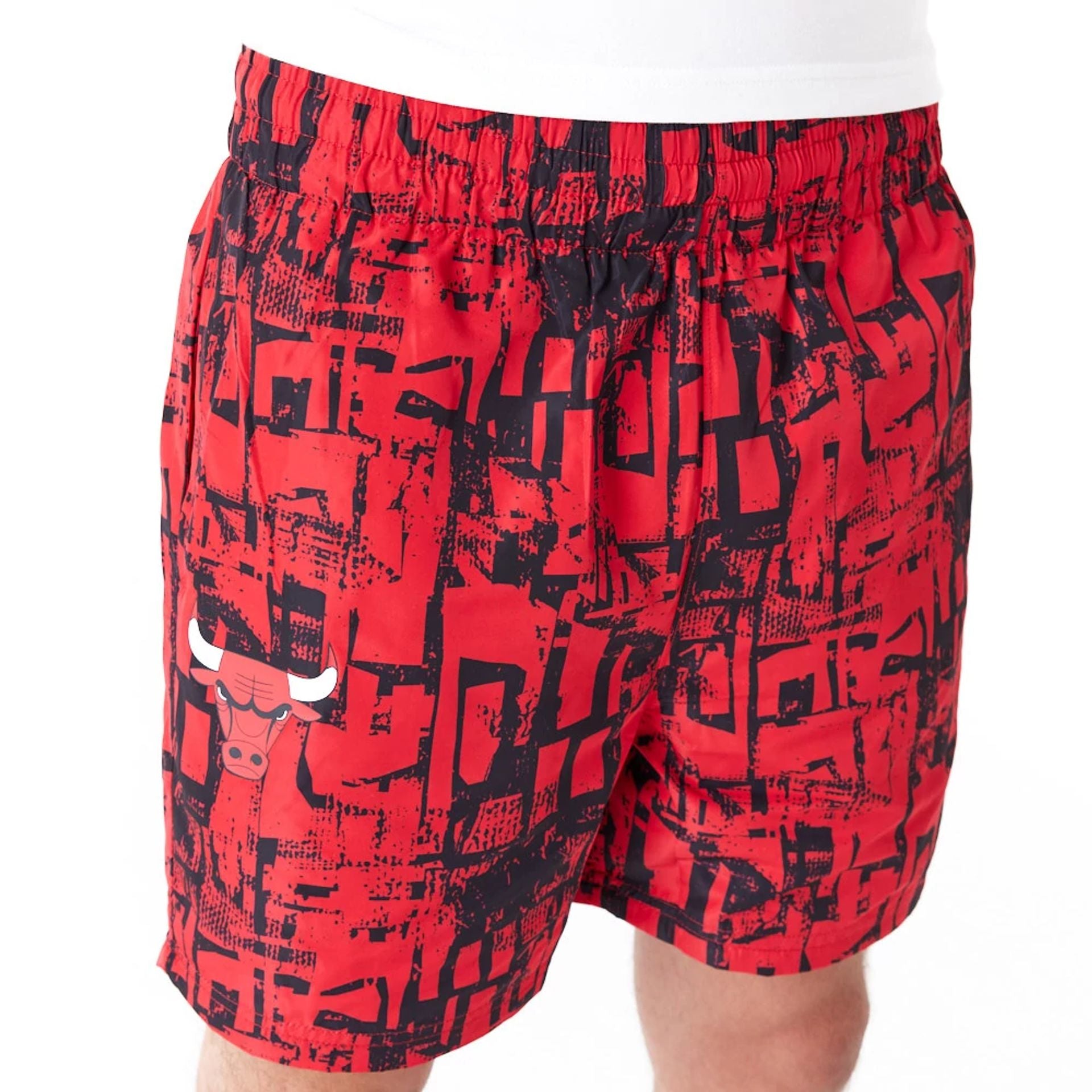 The Male model is wearing Chicago Bulls NBA All Over Print Red Shorts 4