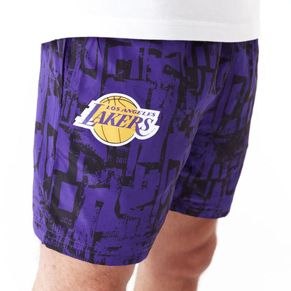 The Male model is wearing LA Lakers NBA All Over Print Purple Shorts 3