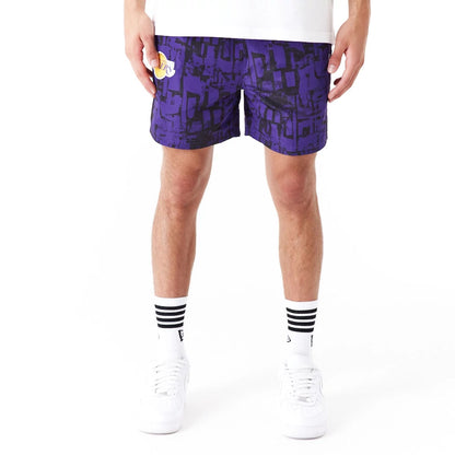 The Male model is wearing LA Lakers NBA All Over Print Purple Shorts 6