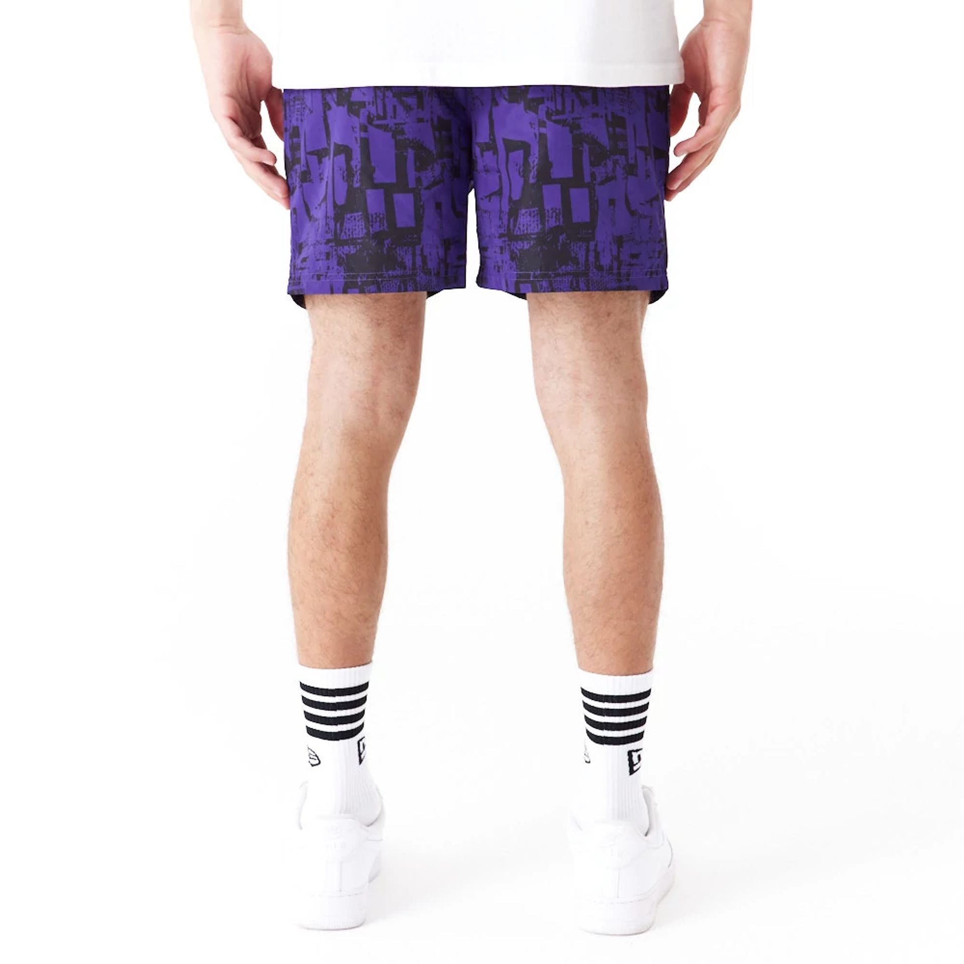 The Male model is wearing LA Lakers NBA All Over Print Purple Shorts 7