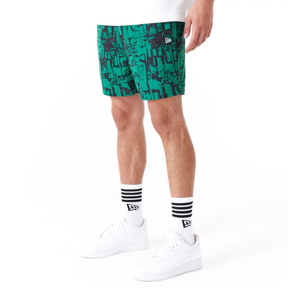 The Male model is wearing Boston Celtics NBA All Over Print Green Shorts 4