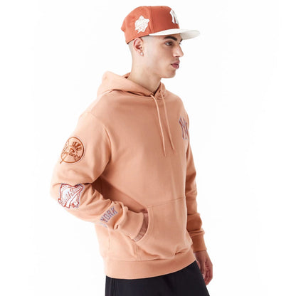 The Male model is wearing New York Yankees MLB World Series Brown Oversized Pullover Hoodie 1