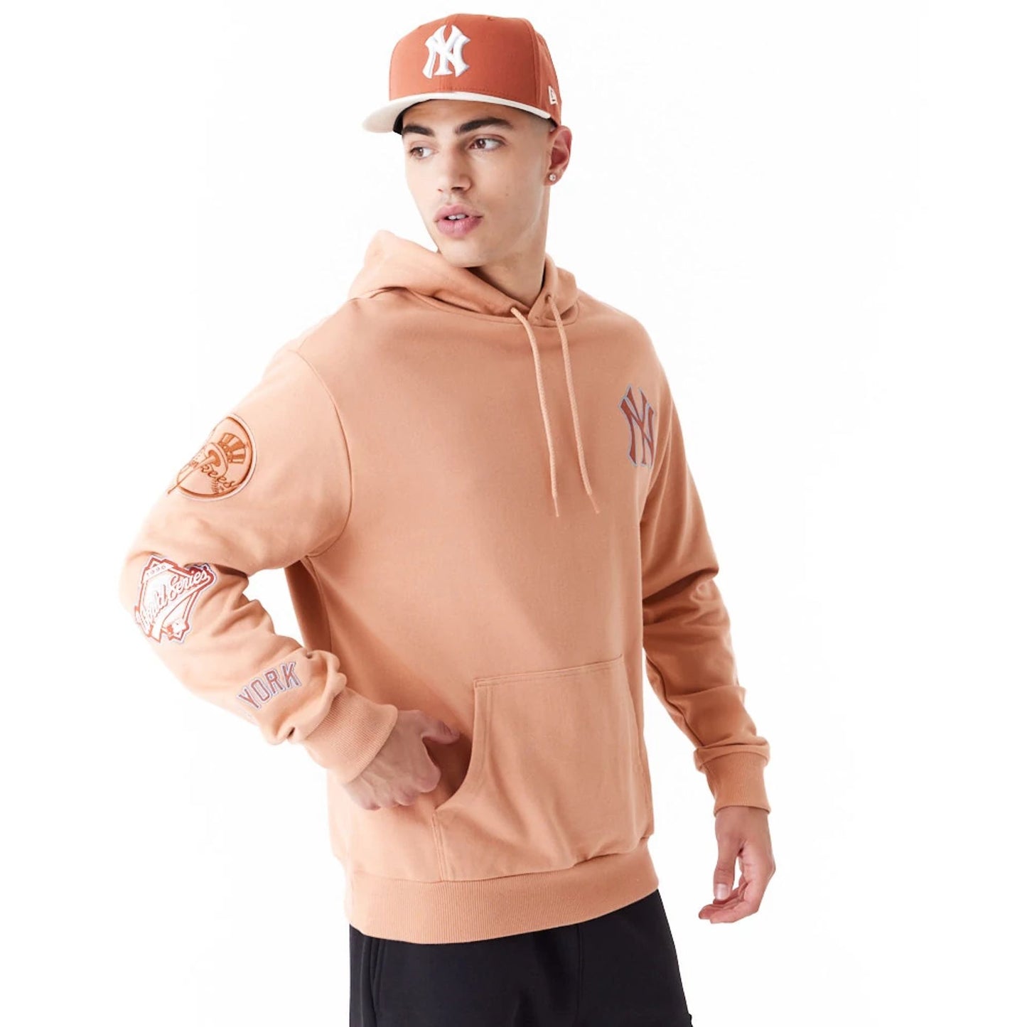 The Male model is wearing New York Yankees MLB World Series Brown Oversized Pullover Hoodie 5