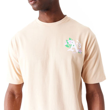 The Male model is wearing Oakland Athletics MLB Floral Graphic Light Beige Oversized T-Shirt 6