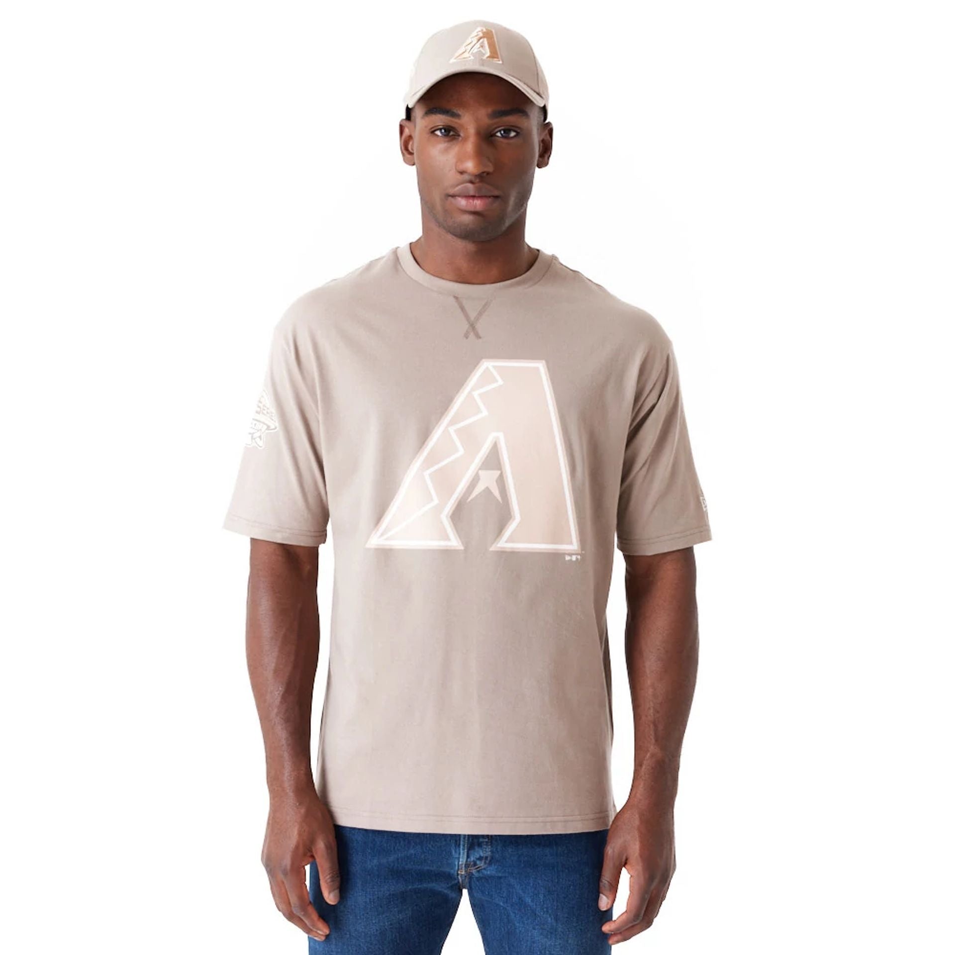 The Male model is wearing Arizona Diamondbacks World Series Pastel Brown Oversized T-Shirt 1