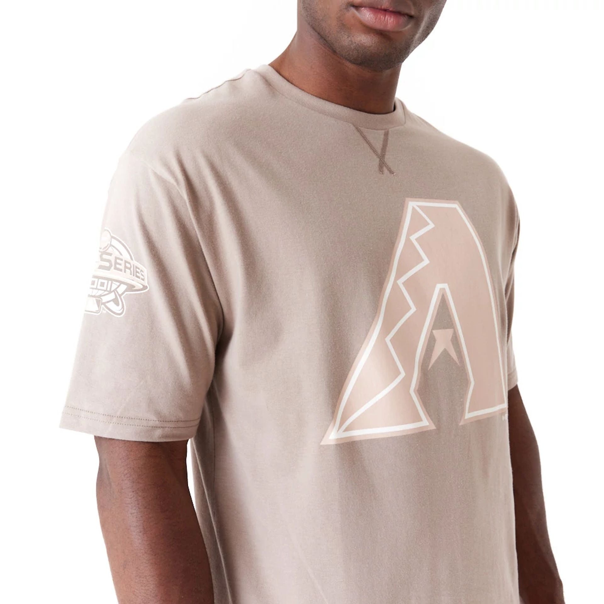 The Male model is wearing Arizona Diamondbacks World Series Pastel Brown Oversized T-Shirt 3