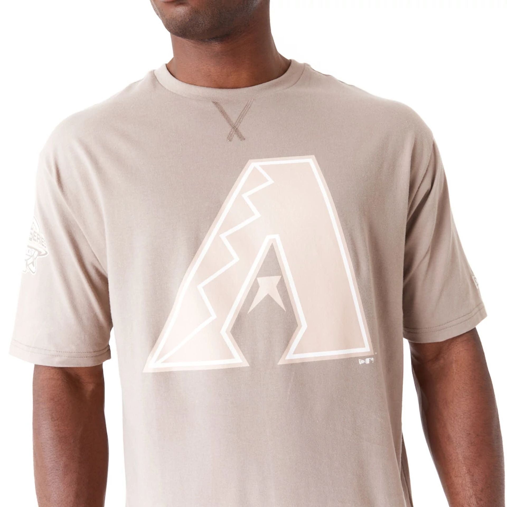 The Male model is wearing Arizona Diamondbacks World Series Pastel Brown Oversized T-Shirt 2