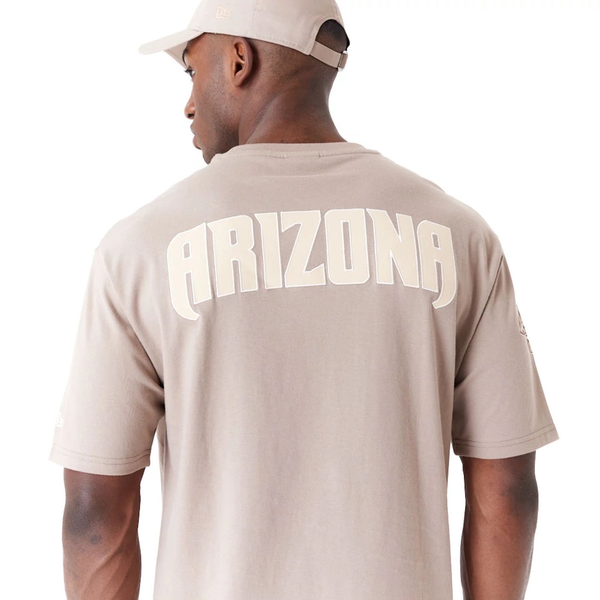 The Male model is wearing Arizona Diamondbacks World Series Pastel Brown Oversized T-Shirt 5