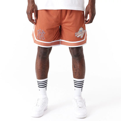 The Male model is wearing New York Yankees World Series Brown Mesh Shorts 8