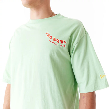 The Male model is wearing NFL Pro Bowl Hawaii NFC Graphic Bright Green Oversized T-Shirt 4