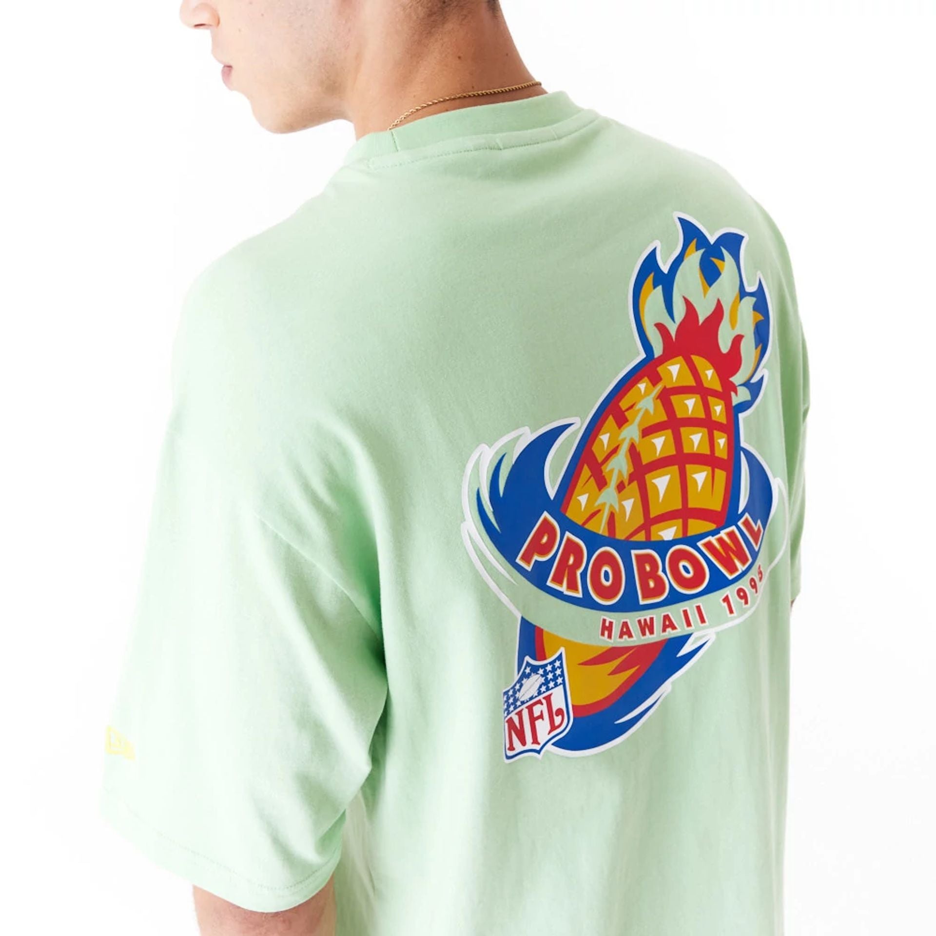 The Male model is wearing NFL Pro Bowl Hawaii NFC Graphic Bright Green Oversized T-Shirt 2