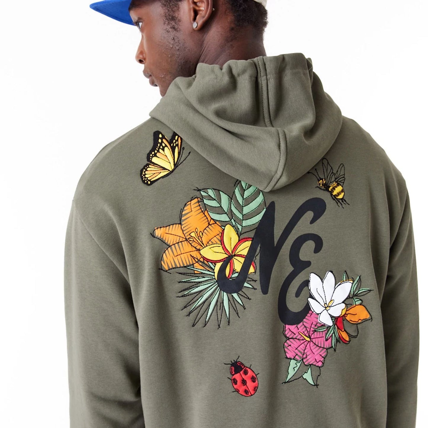 The Male model is wearing New Era Floral Graphic Green Oversized Pullover Hoodie 4