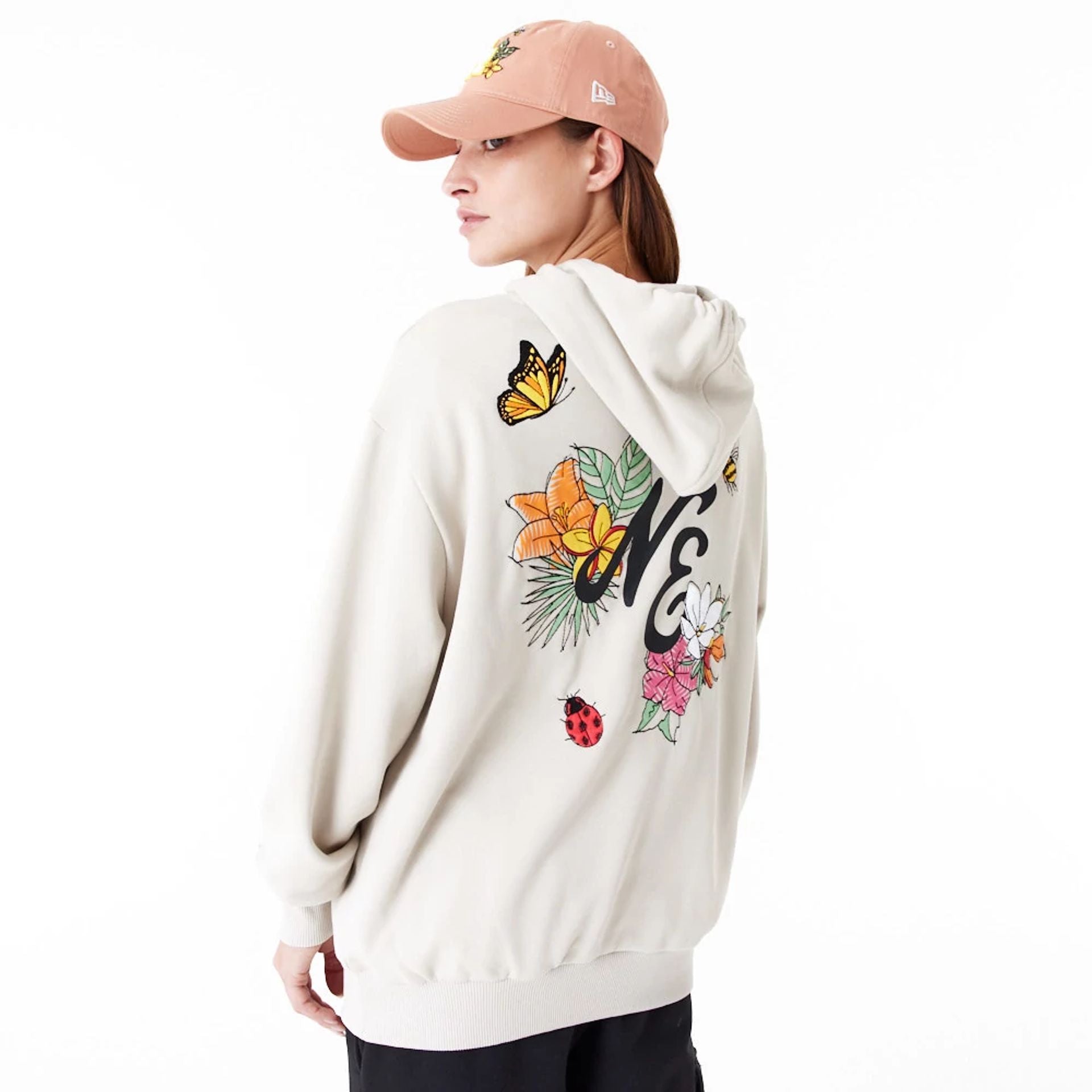 The Male model is wearing New Era Floral Graphic Stone Oversized Pullover Hoodie 7