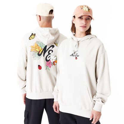 The Male model is wearing New Era Floral Graphic Stone Oversized Pullover Hoodie 1