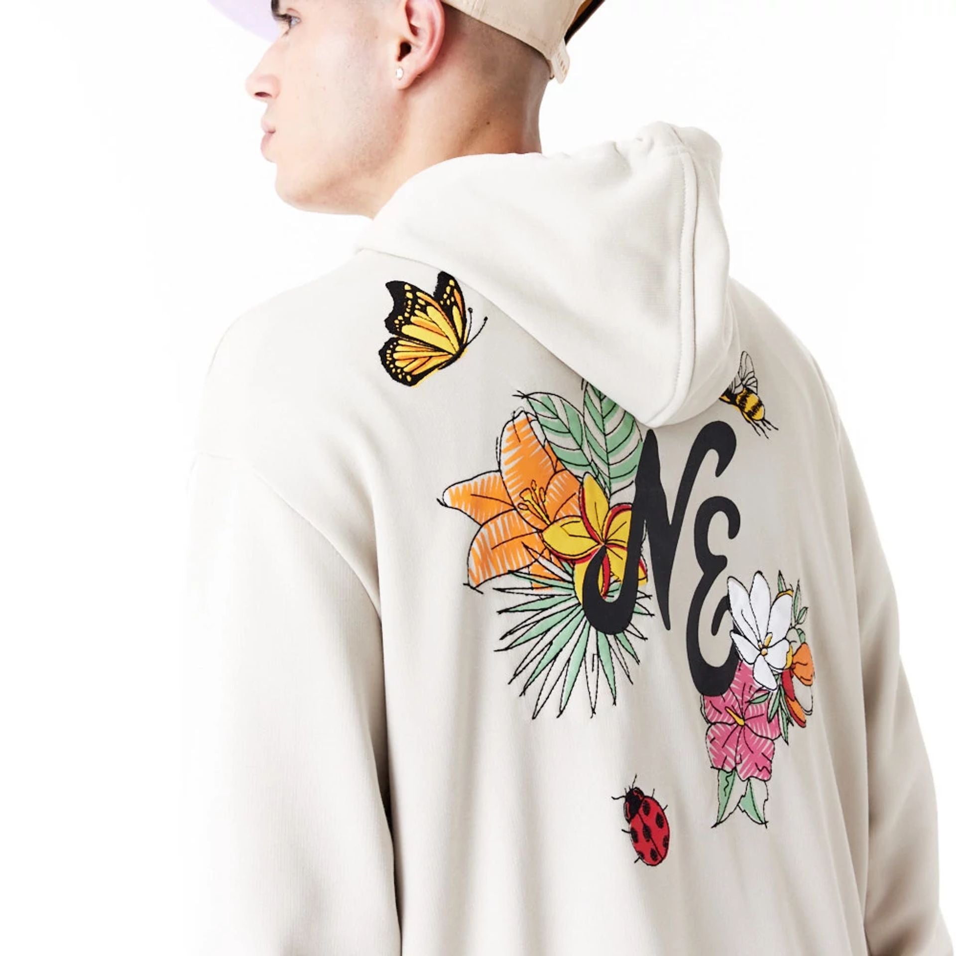 The Male model is wearing New Era Floral Graphic Stone Oversized Pullover Hoodie 3