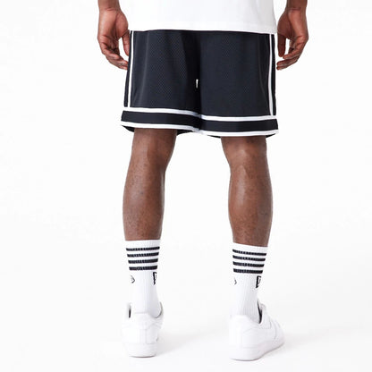 The Male model is wearing Las Vegas Raiders NFL Colour Block Black Shorts 3