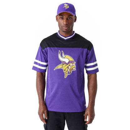 The Male model is wearing Minnesota Vikings NFL Wordmark Graphic Purple T-Shirt 1