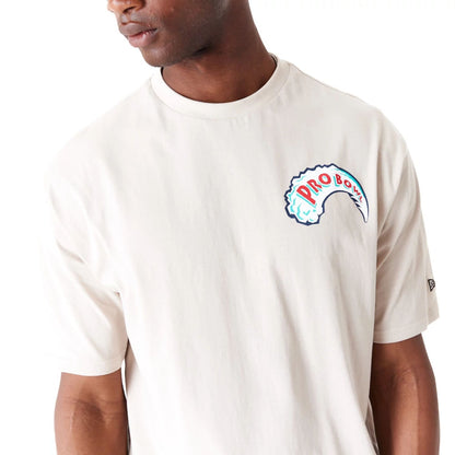 The Male model is wearing NFL Pro Bowl Hawaii NFC Wave Graphic Light Beige Oversized T-Shirt 3