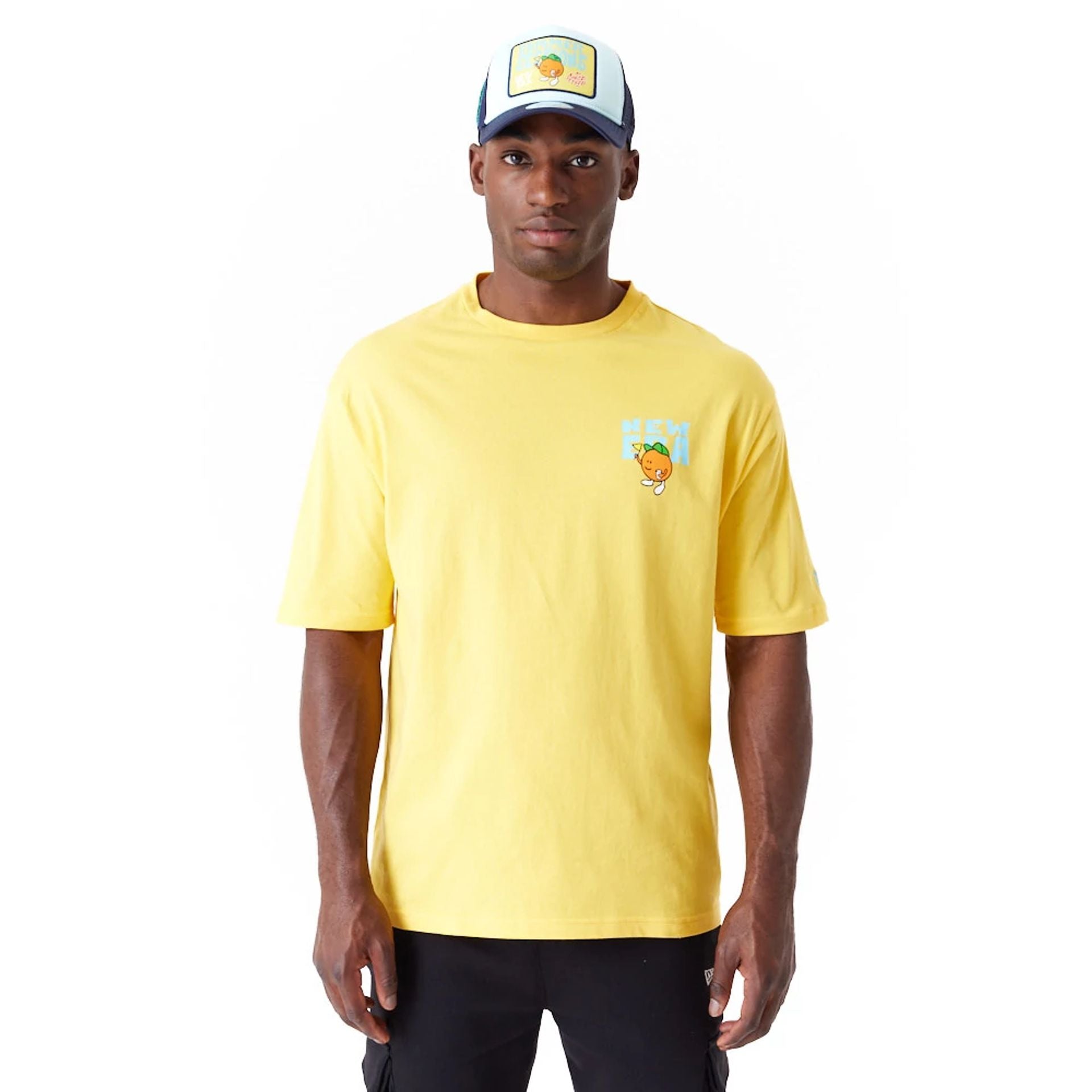 The Male model is wearing New Era Pool Party Fruit Graphic Yellow Oversized T-Shirt 1