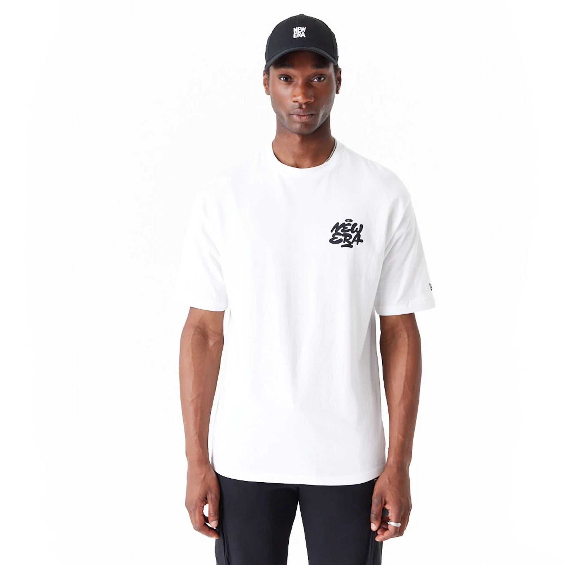 The Male model is wearing New Era Spray Graphic White Oversized T-Shirt 1