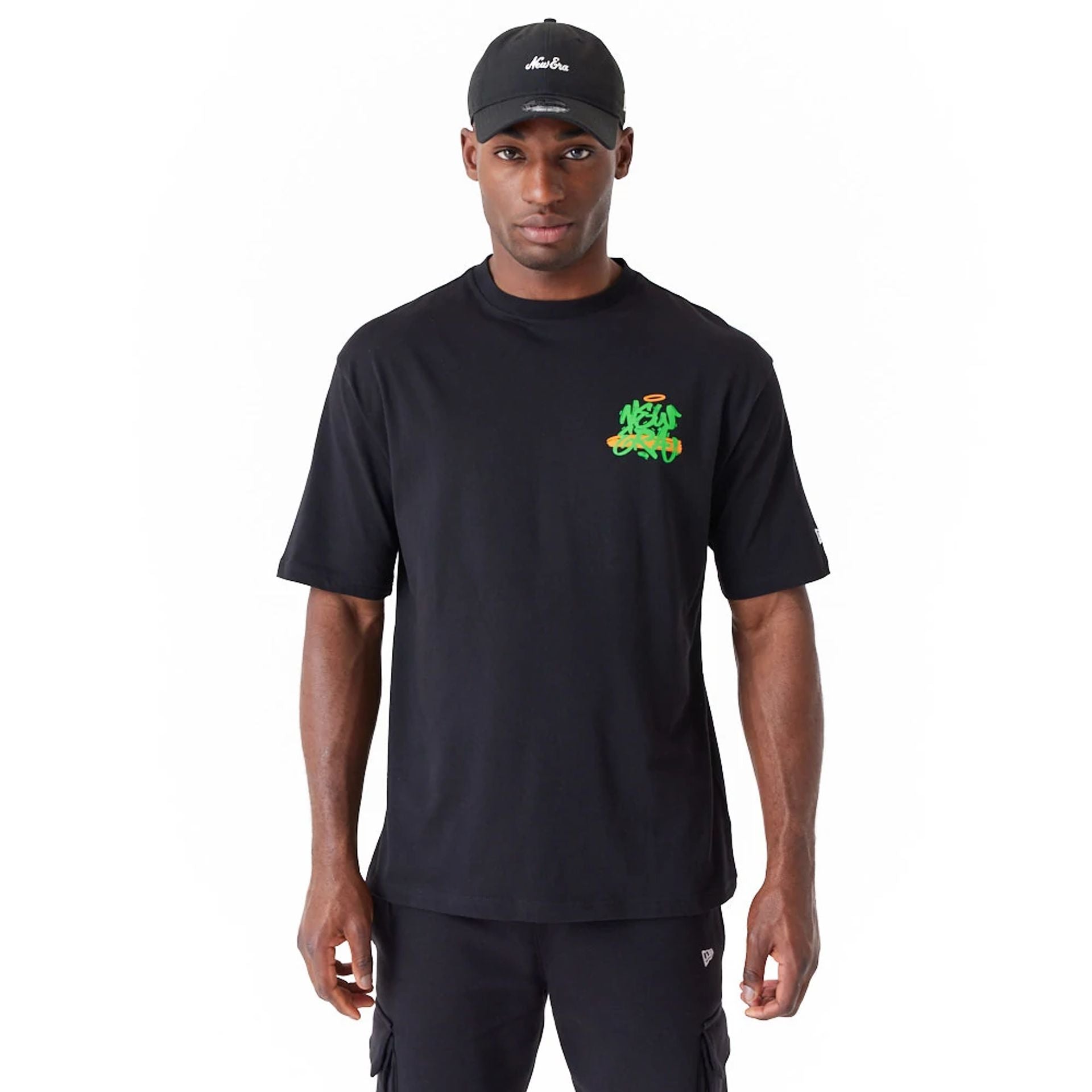 The Male model is wearing New Era Spray Graphic Black Oversized T-Shirt 1