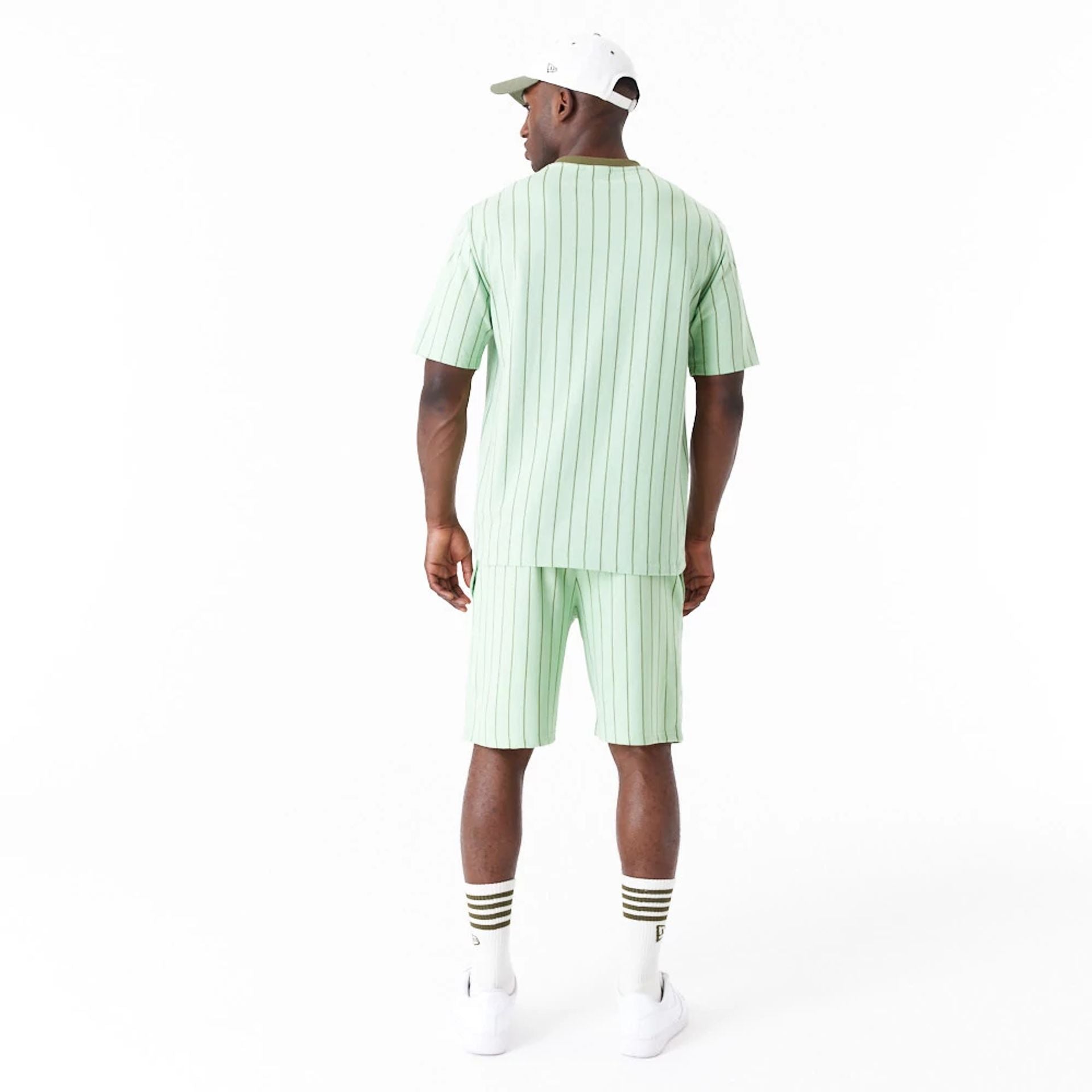 The Male model is wearing New Era Pinstripe Bright Green Oversized T-Shirt 2