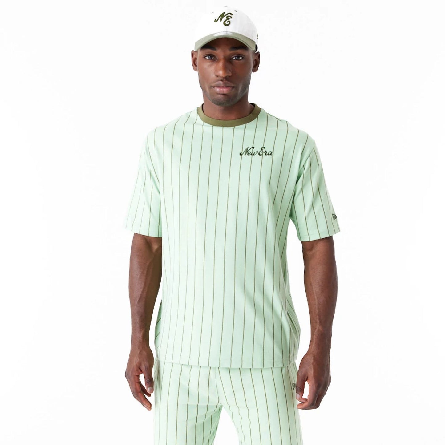 The Male model is wearing New Era Pinstripe Bright Green Oversized T-Shirt 12